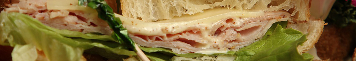 Eating Sandwich at Mirasol's Café restaurant in North Dartmouth, MA.